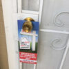 real_estate_door_hanger_on_the_front_door_of_home